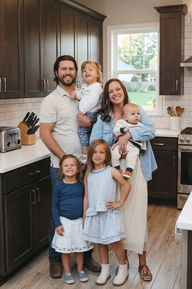 Matt Kawiecki with his wife and four children at home